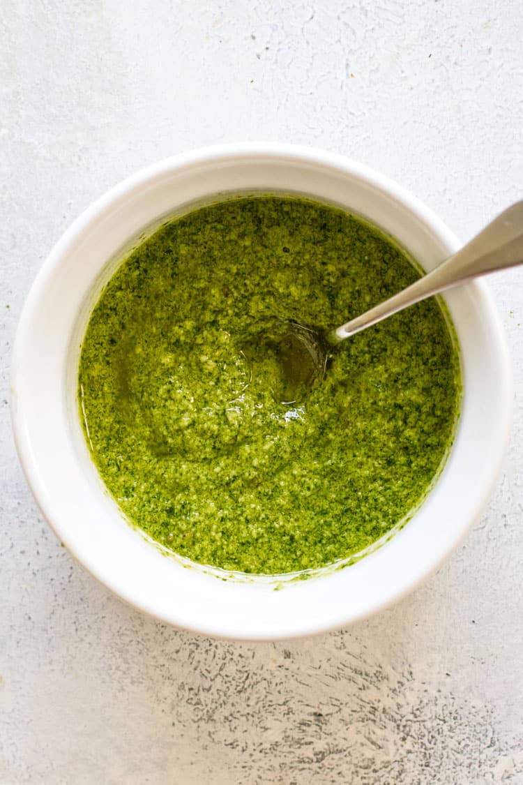 overhead photo of a bowl of homemade pesto