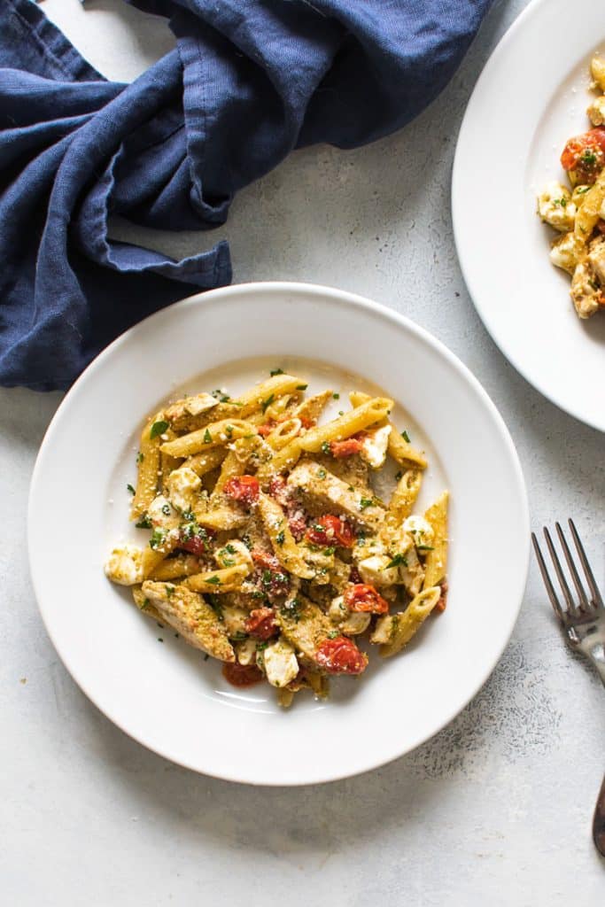 overhead photo of a plate of pesto chicken pasta