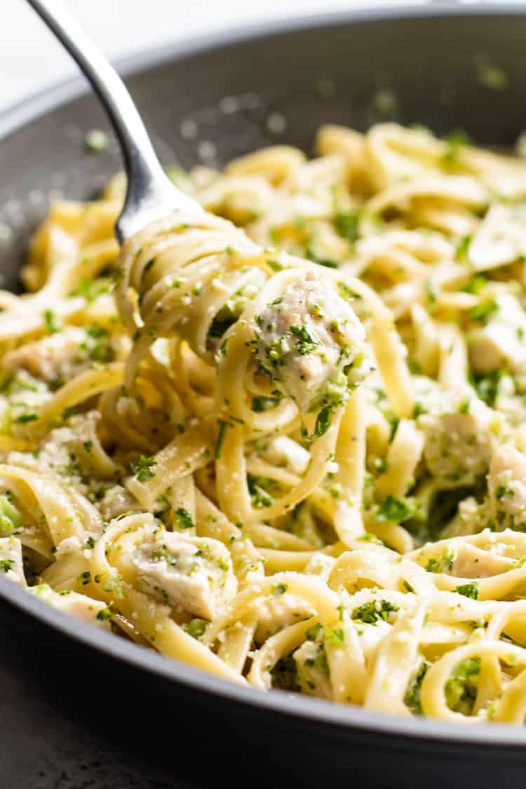 close-up photo of a forkful of chicken broccoli alfredo