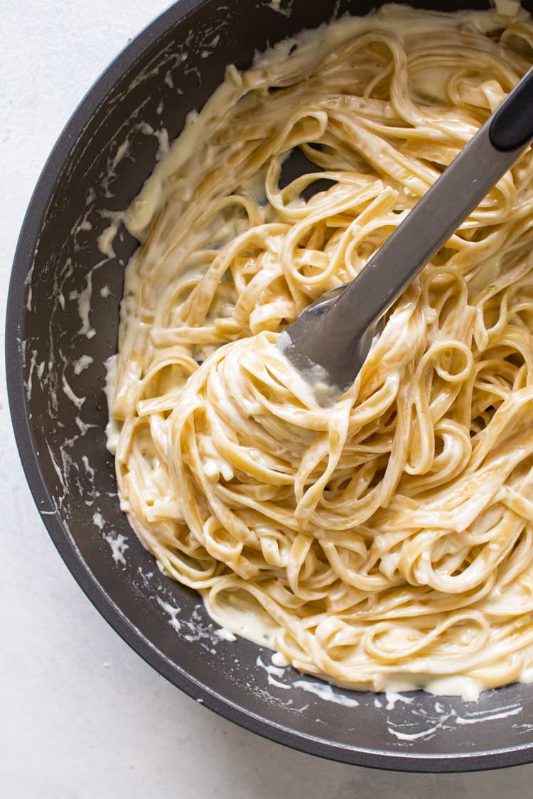 overhead photo of a pan of creamy garlic pasta
