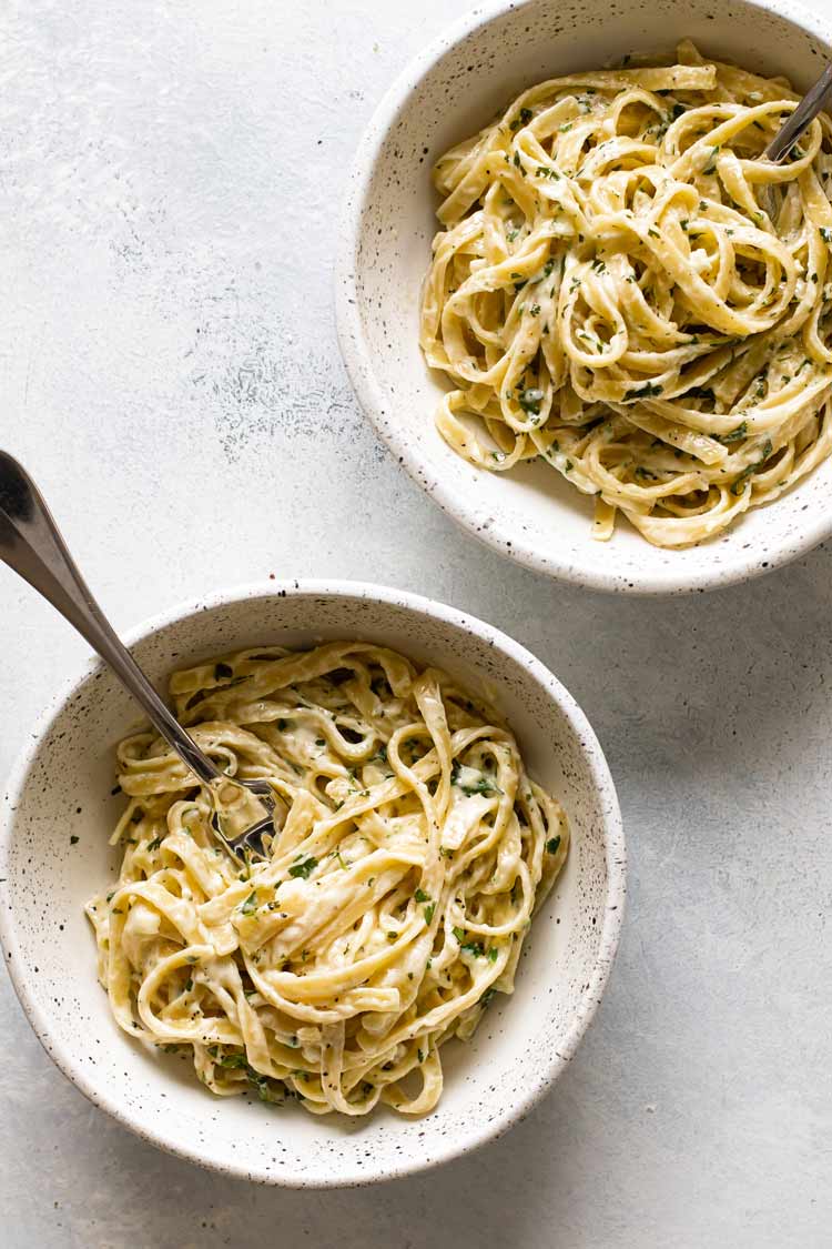 overhead photo of two bowls of pasta