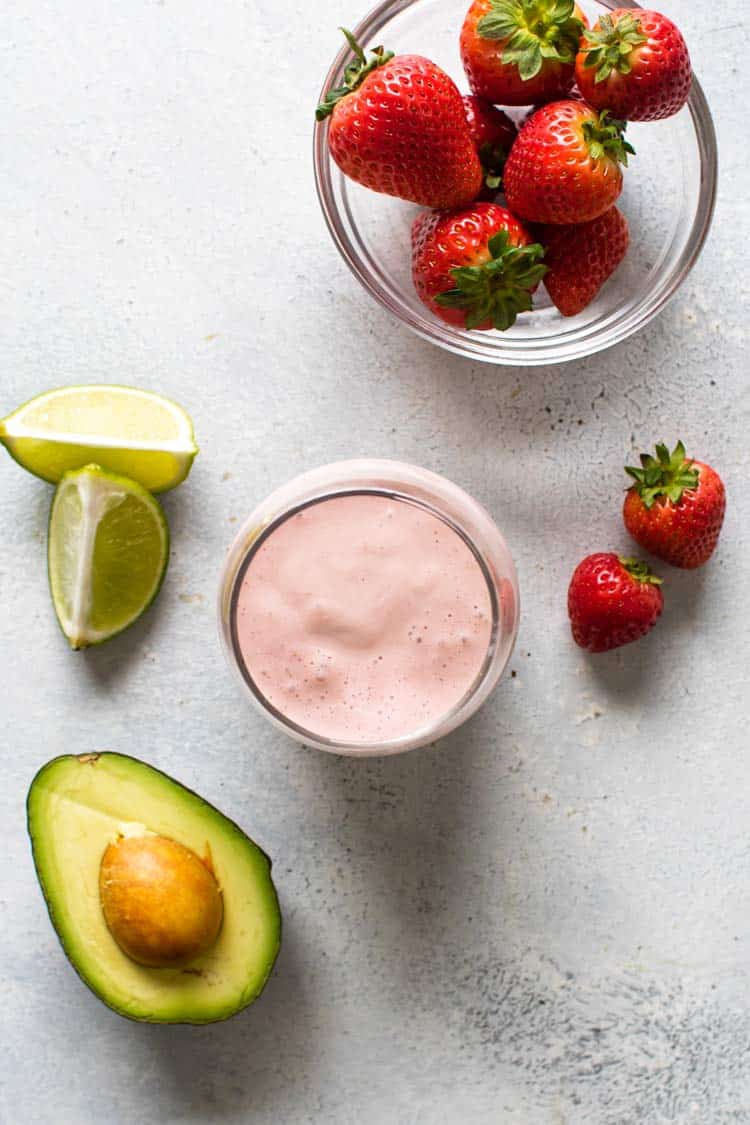 overhead photo of a smoothie with the ingredients around it