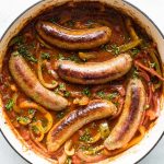 overehead photo of sausage and peppers in sauce