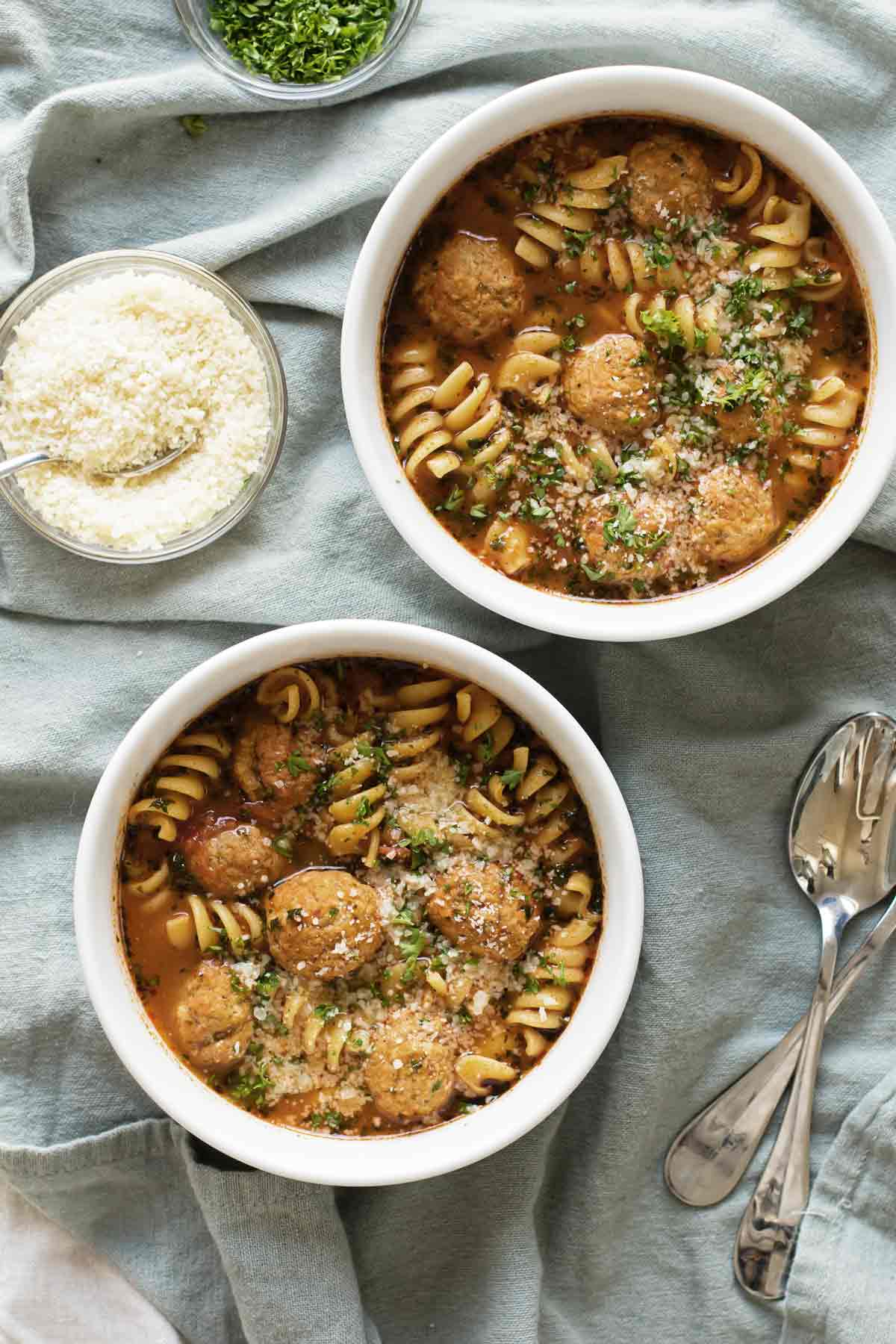 Overhead photo of two bowls of meatballs soup