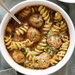 photo of one bowl of soup with meatballs and pasta