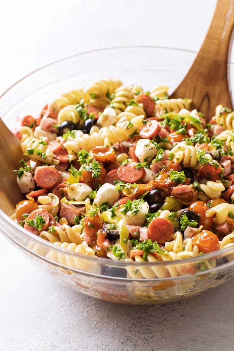 pasta salad in a clear glass serving bowl