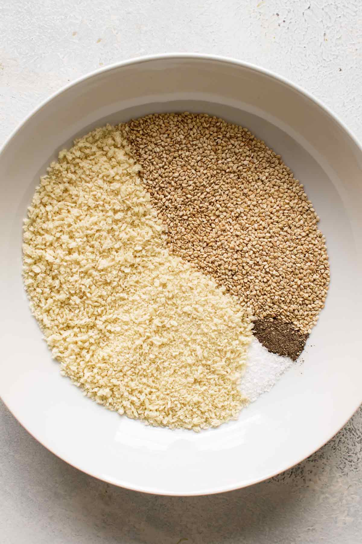 overhead photo of a bowl with the breading ingredients