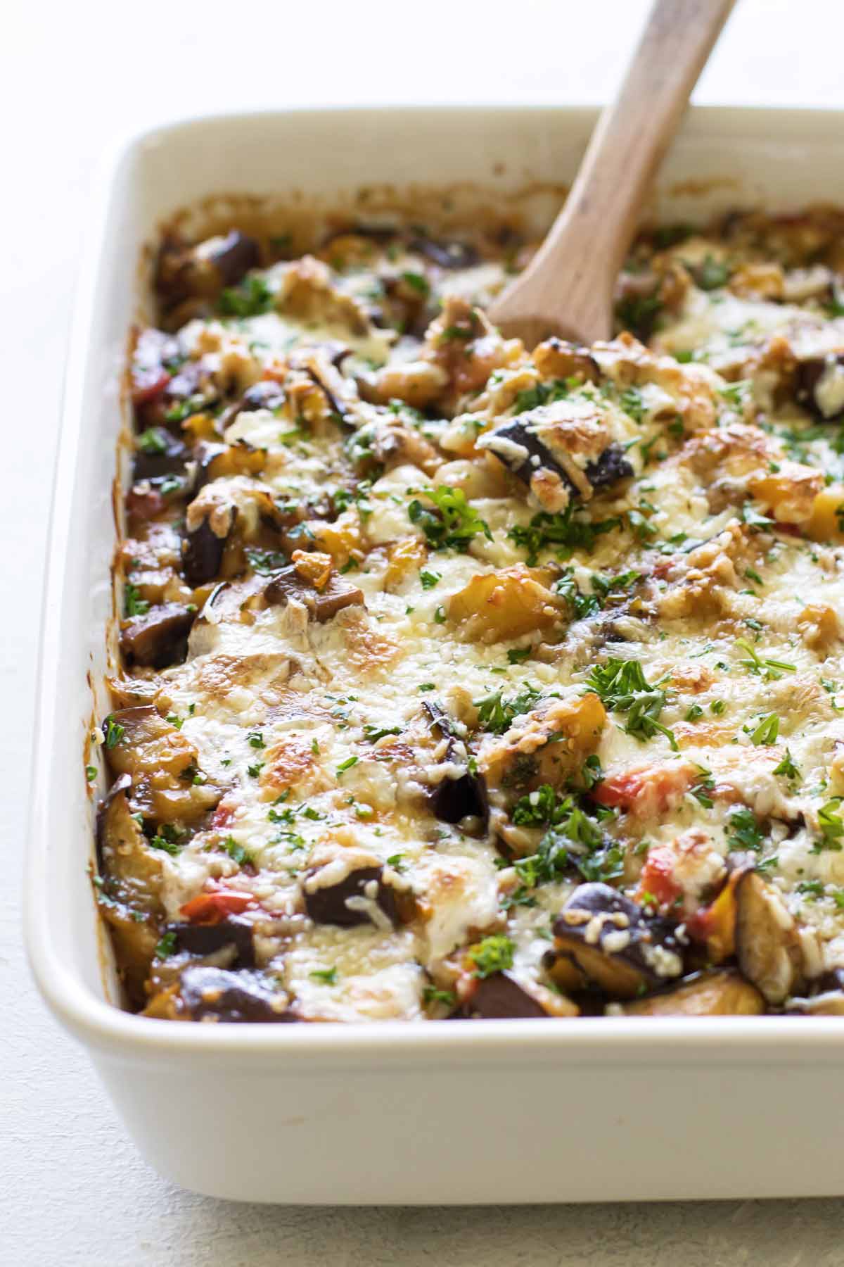 close-up photo of the casserole with a wooden spoon