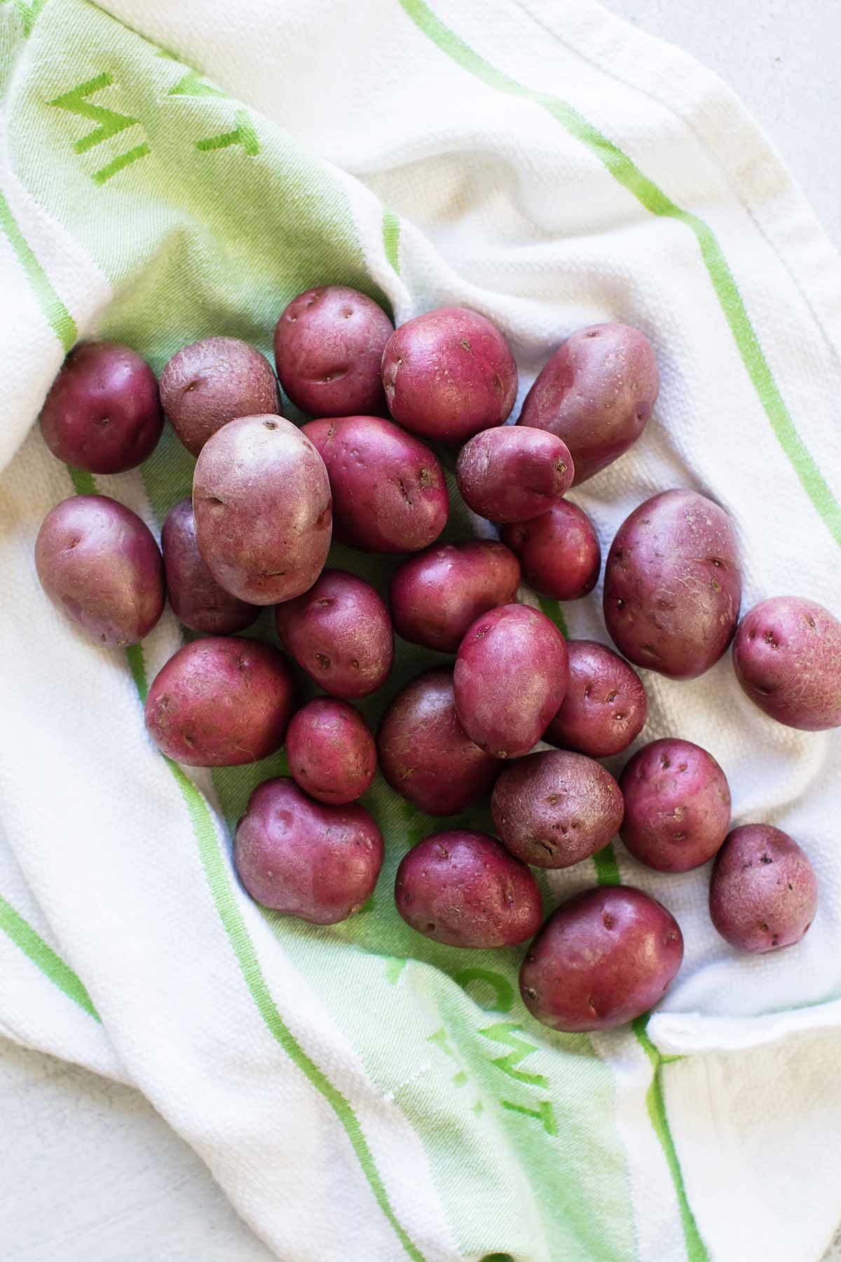 overhead photo of red potatoes on a dish towel