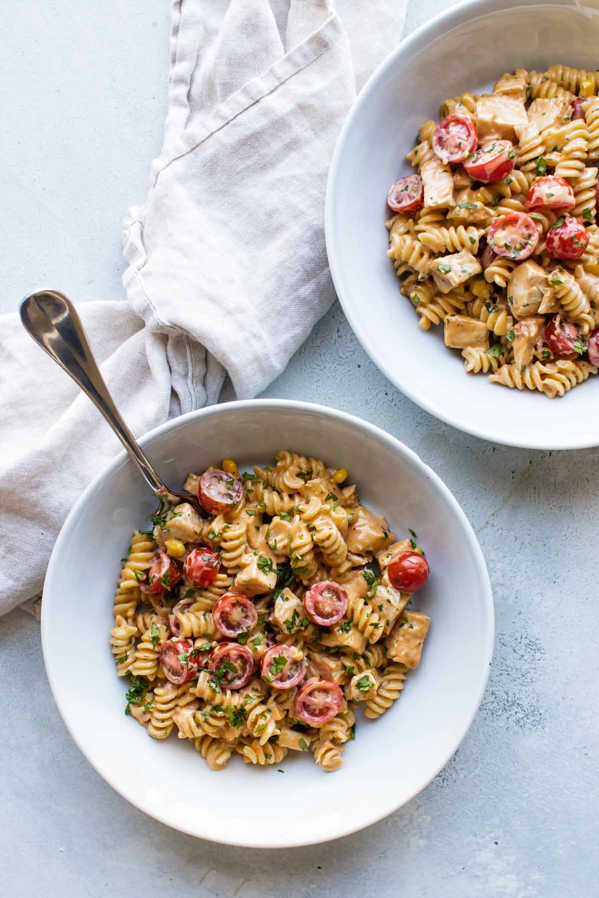 overhead photo of two bowls of chicken pasta