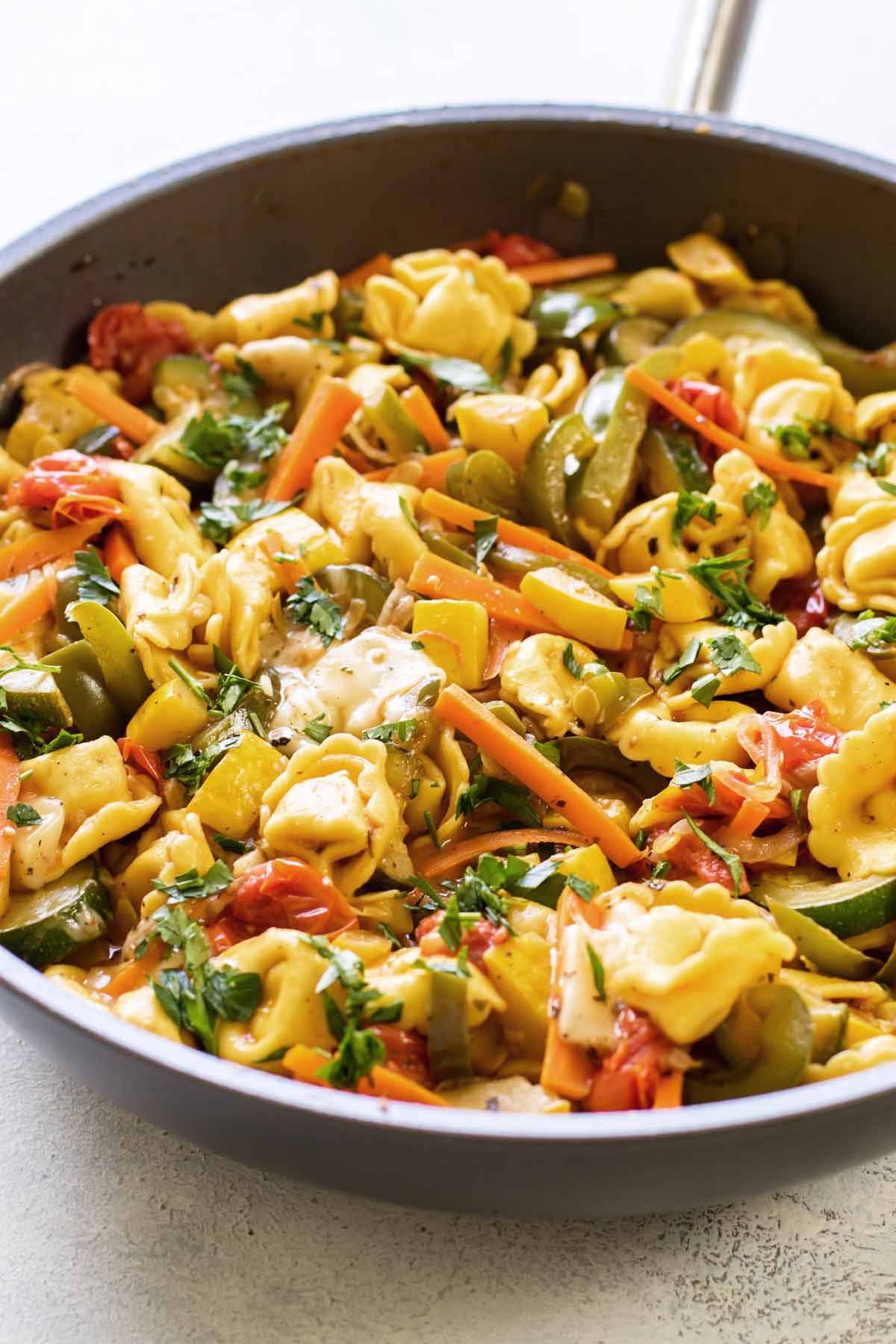 close-up photo of skillet with pasta and vegetables