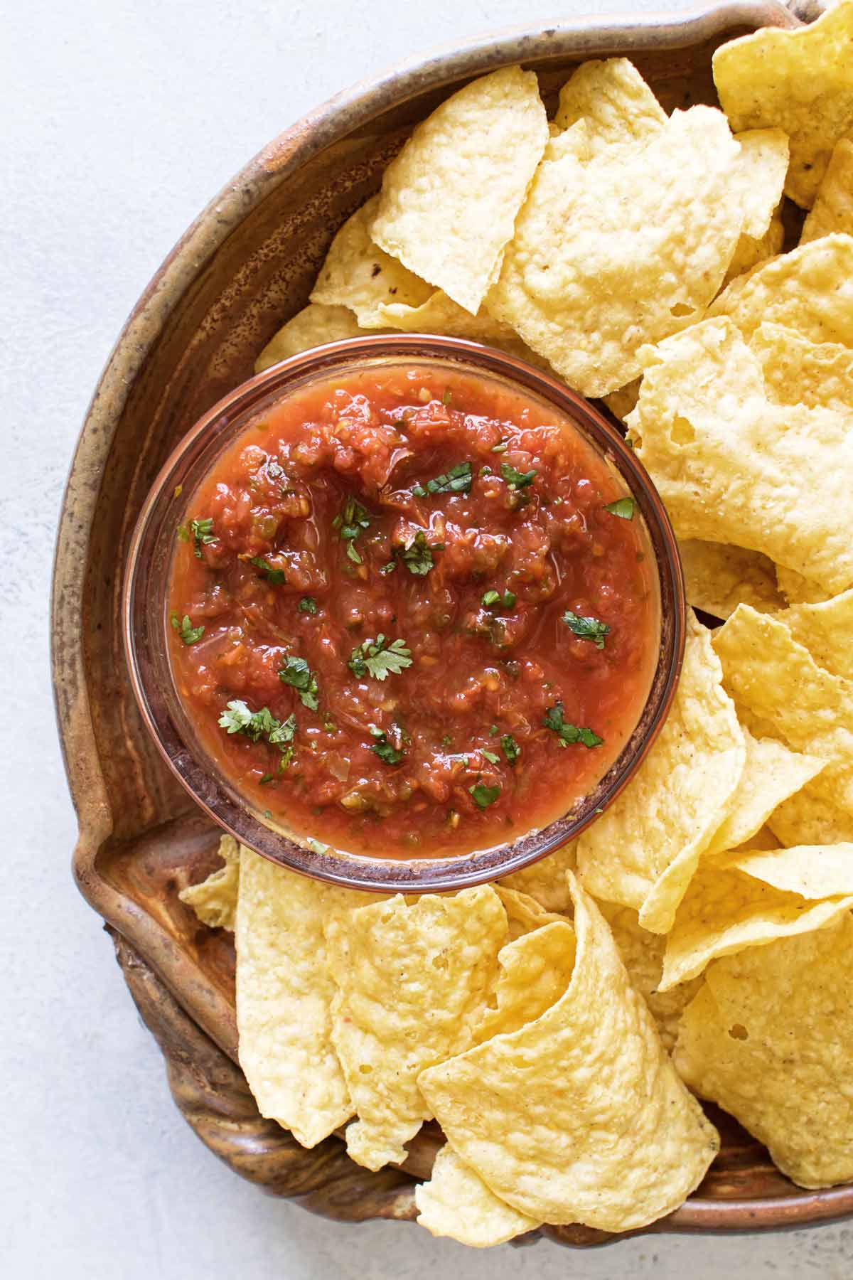 This homemade salsa is easy to make with fresh ingredients and has the best texture - not too thin, not too chunky, not too thick! Learn how to make it and you'll skip the store-bought kind.