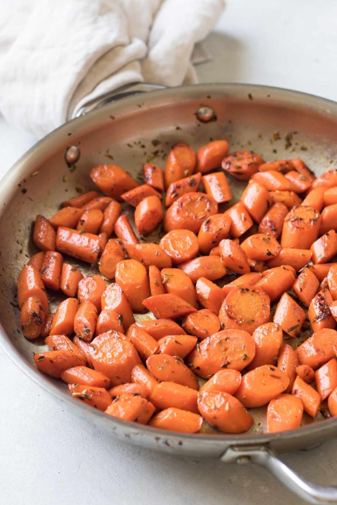 glazed carrots in a pan.