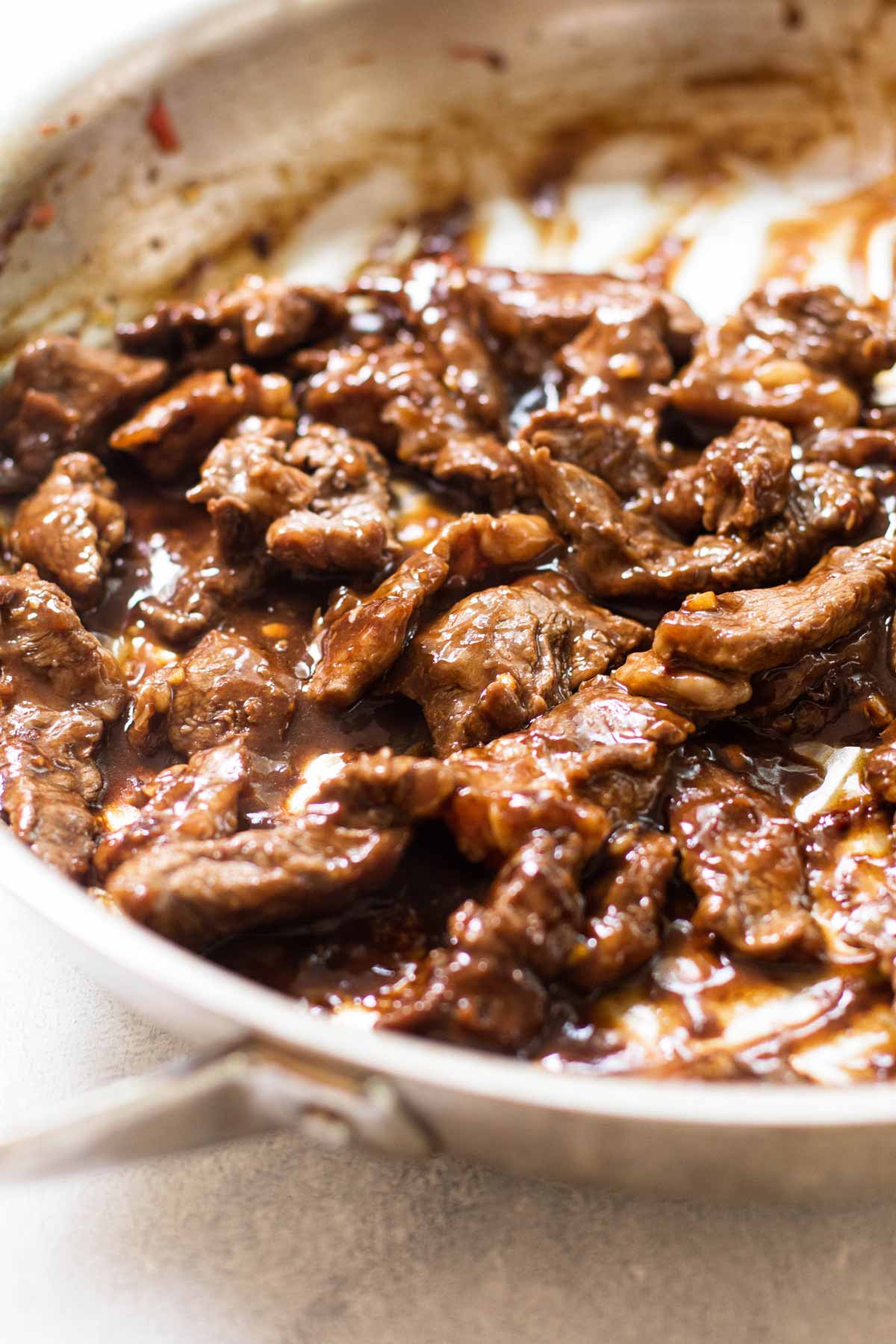 beef and sauce in a skillet.
