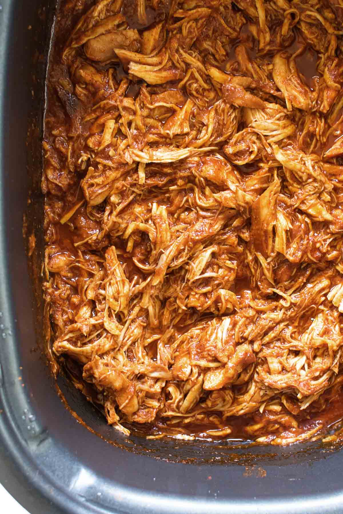 shredded bbq chicken in a slow cooker.