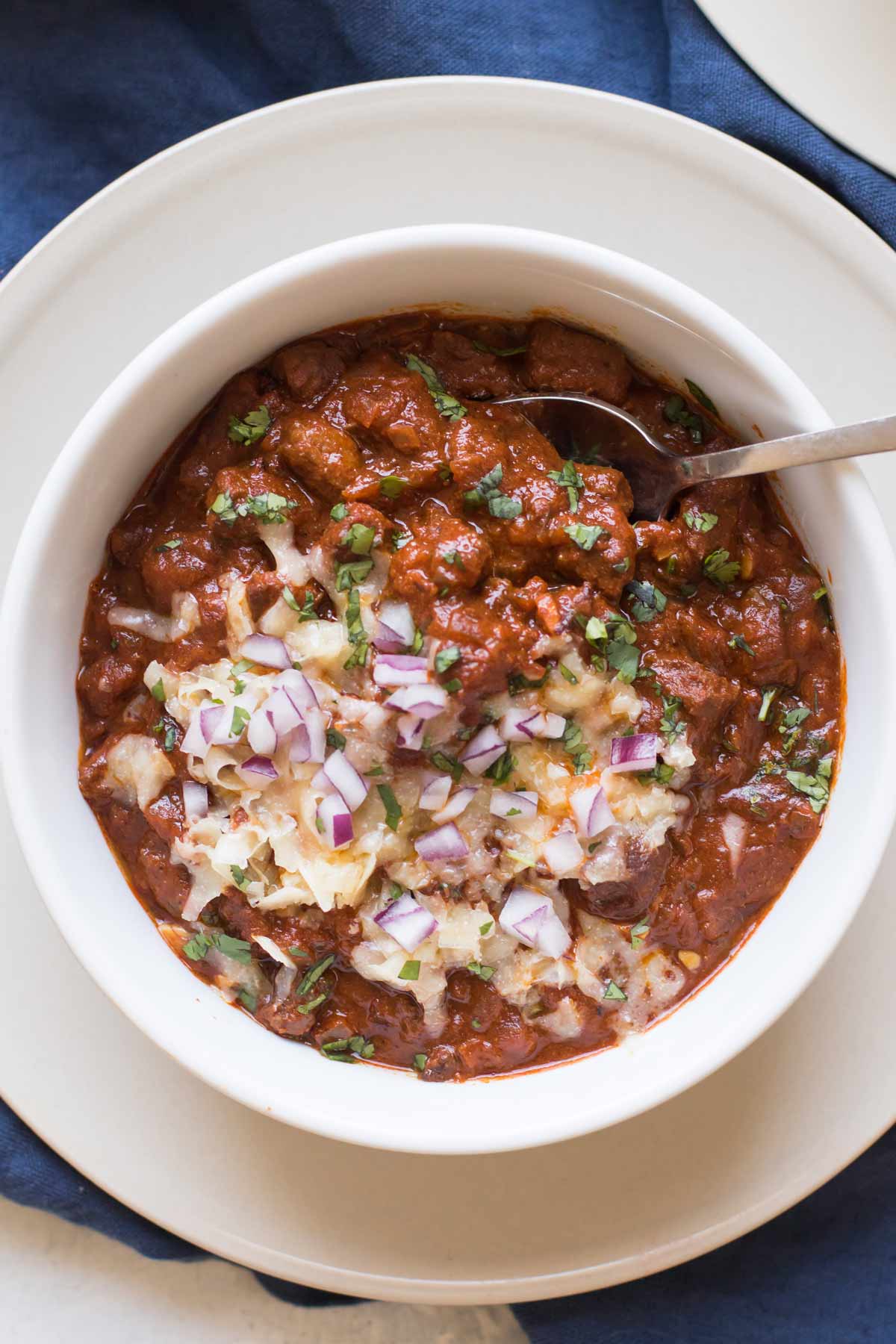 bowl of Texas chili with toppings