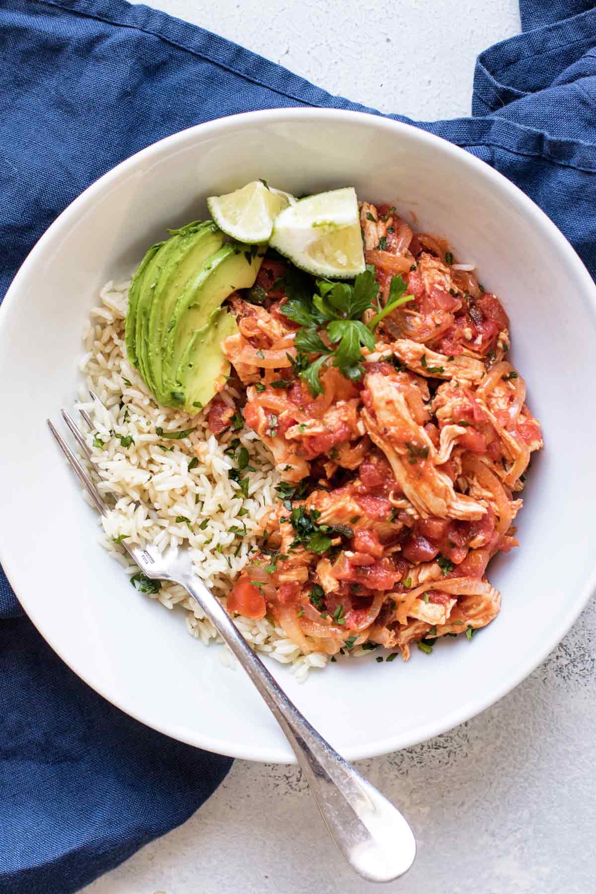 chicken tinga in a bowl with rice