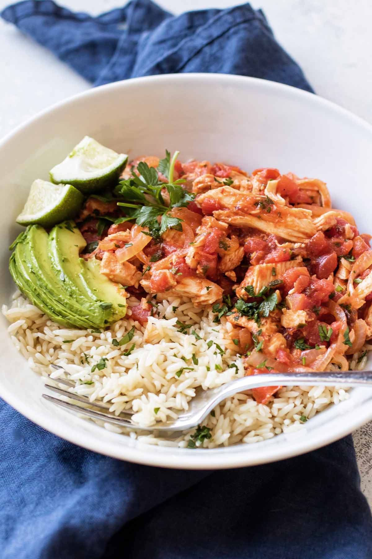 a bowl with rice and chicken tinga