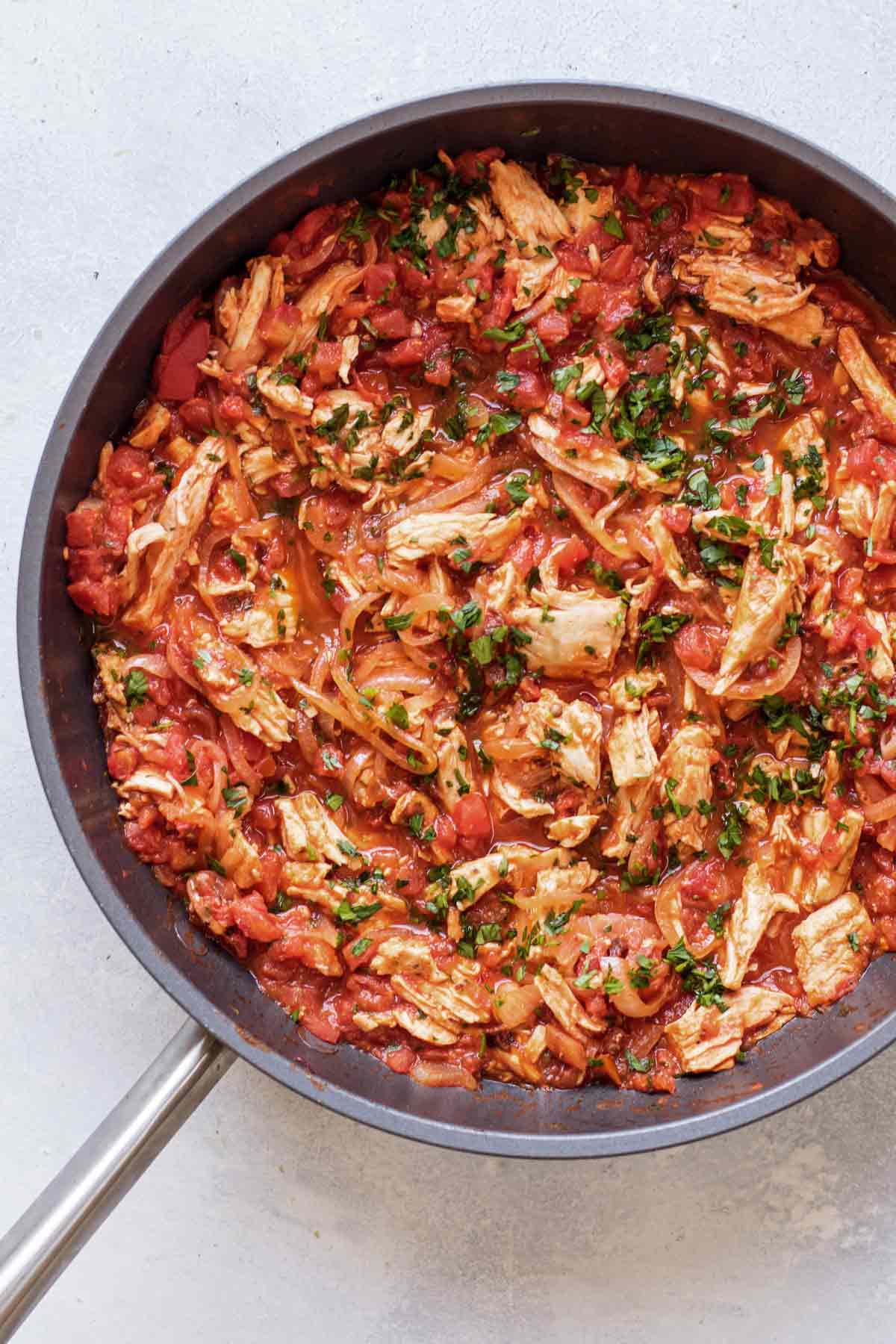 chicken tinga in a skillet.