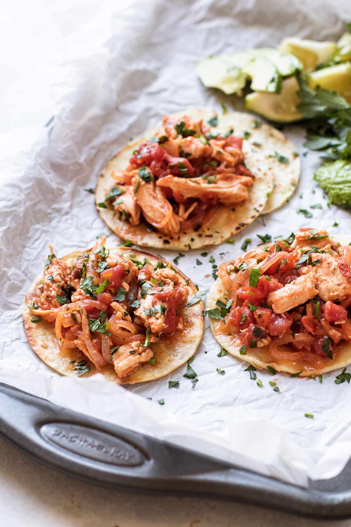 chicken tinga tacos on a sheet pan