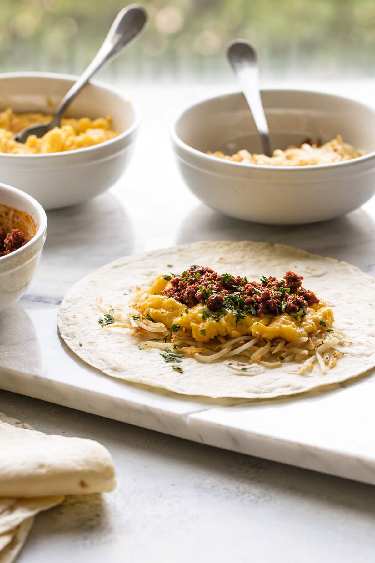 photo of a burrito being made