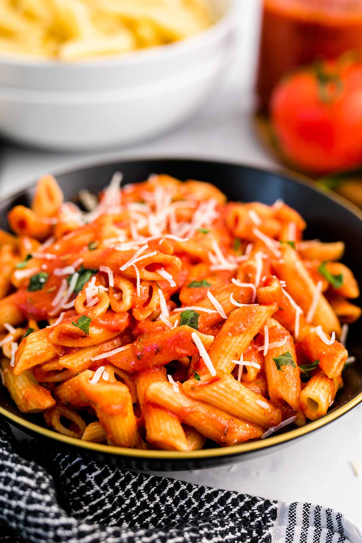 a bowl of penne pasta with pasta sauce