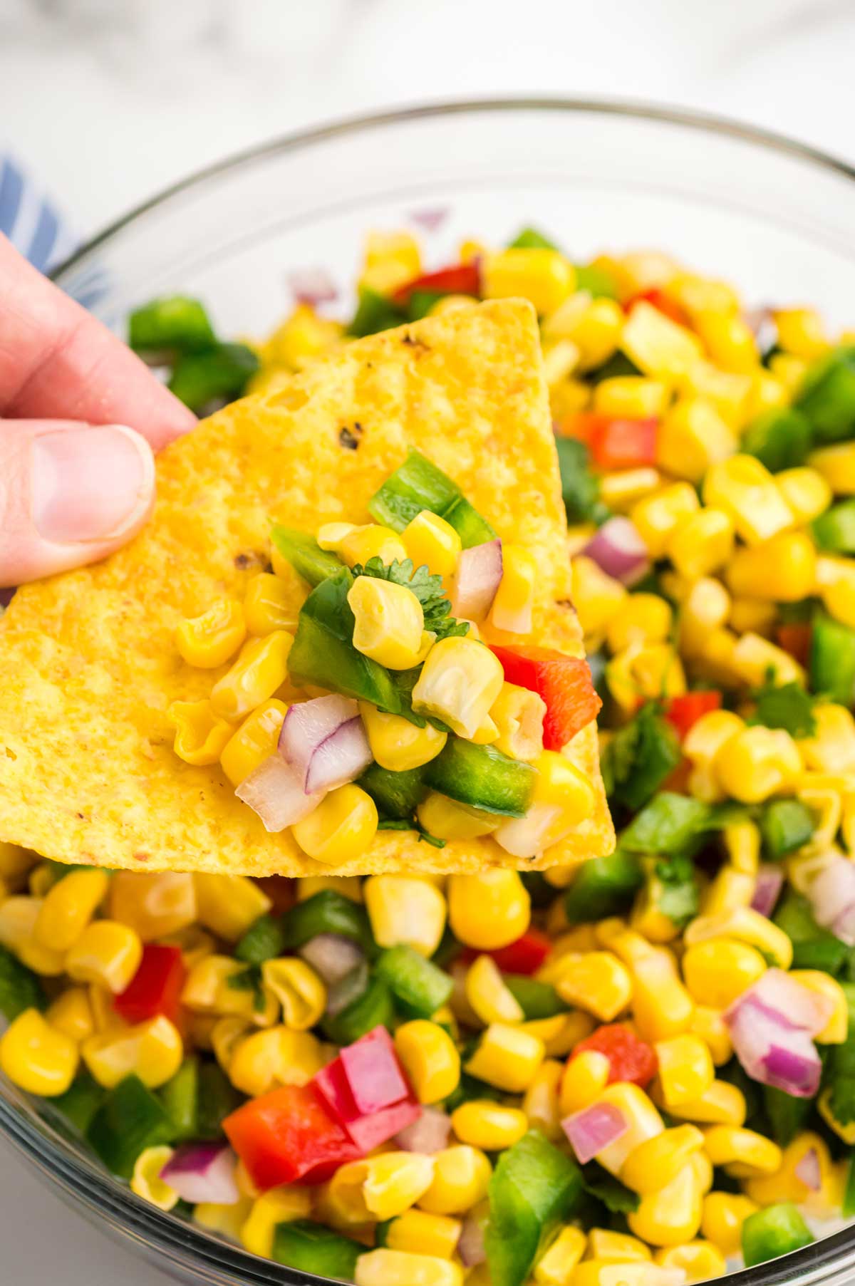 a chip with corn salsa.