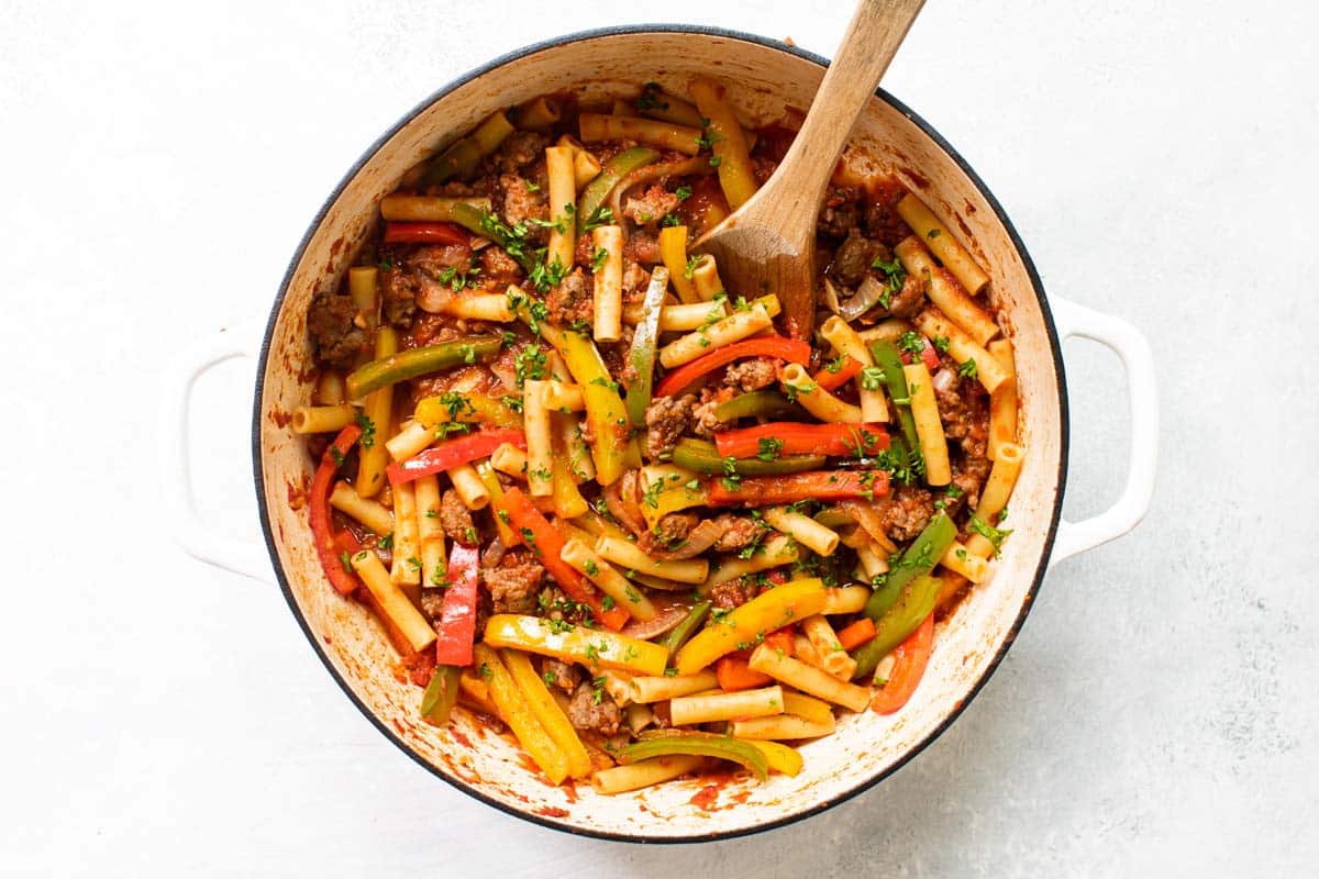 peppers and sausage pasta in a pan.
