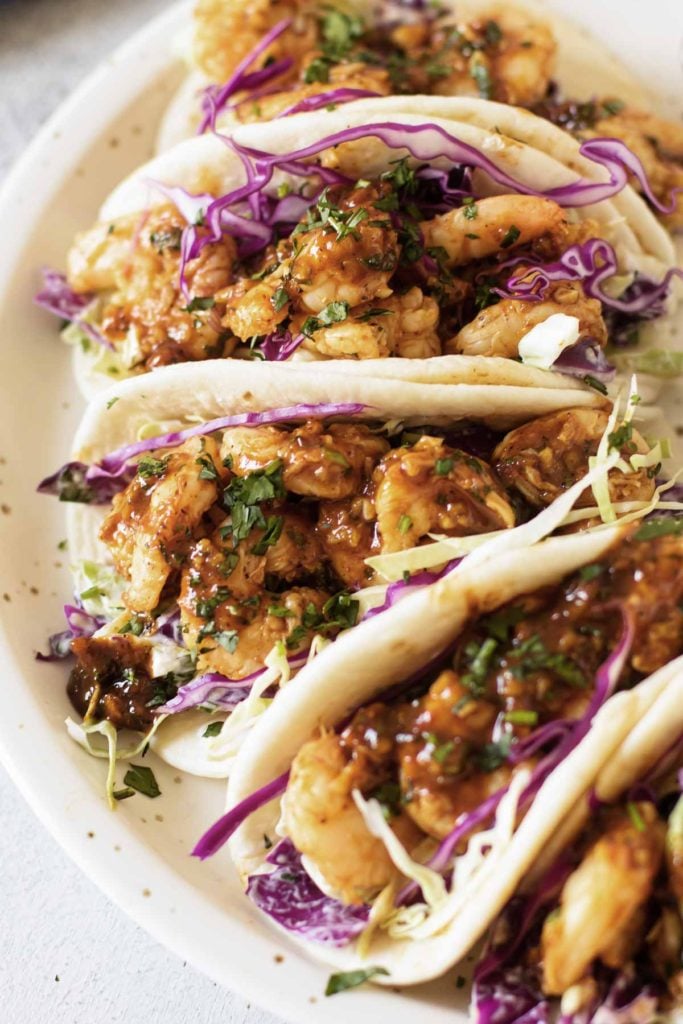 a plate of shrimp tacos.