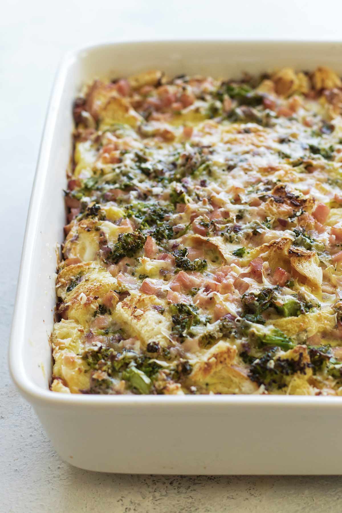 a ham and broccoli strata in a baking dish.