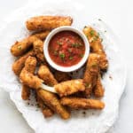 fried cheese sticks on a plate.