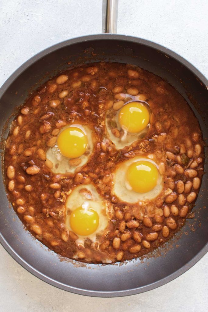 eggs in the skillet with the beans.