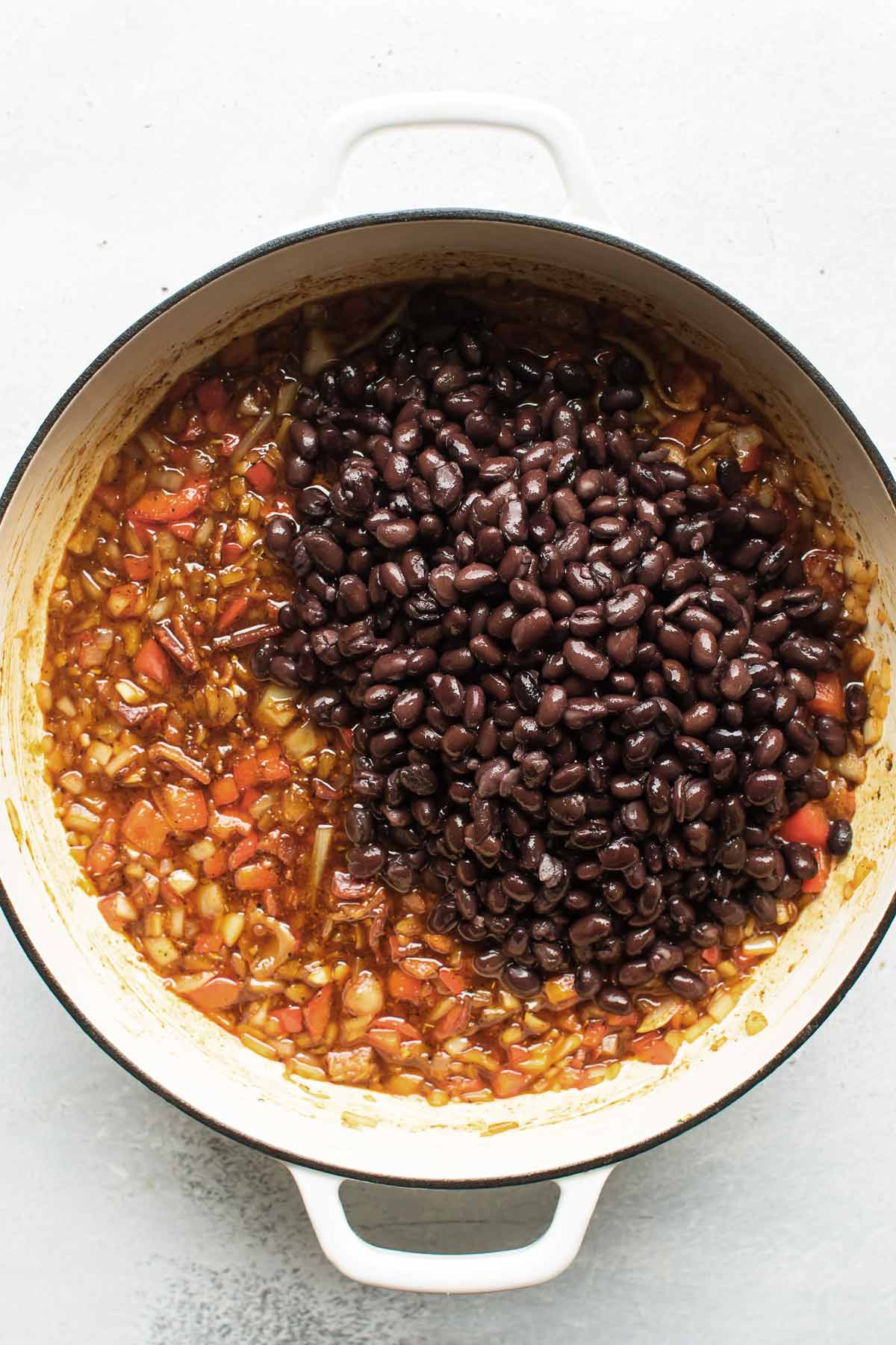 black beans added to the pan.