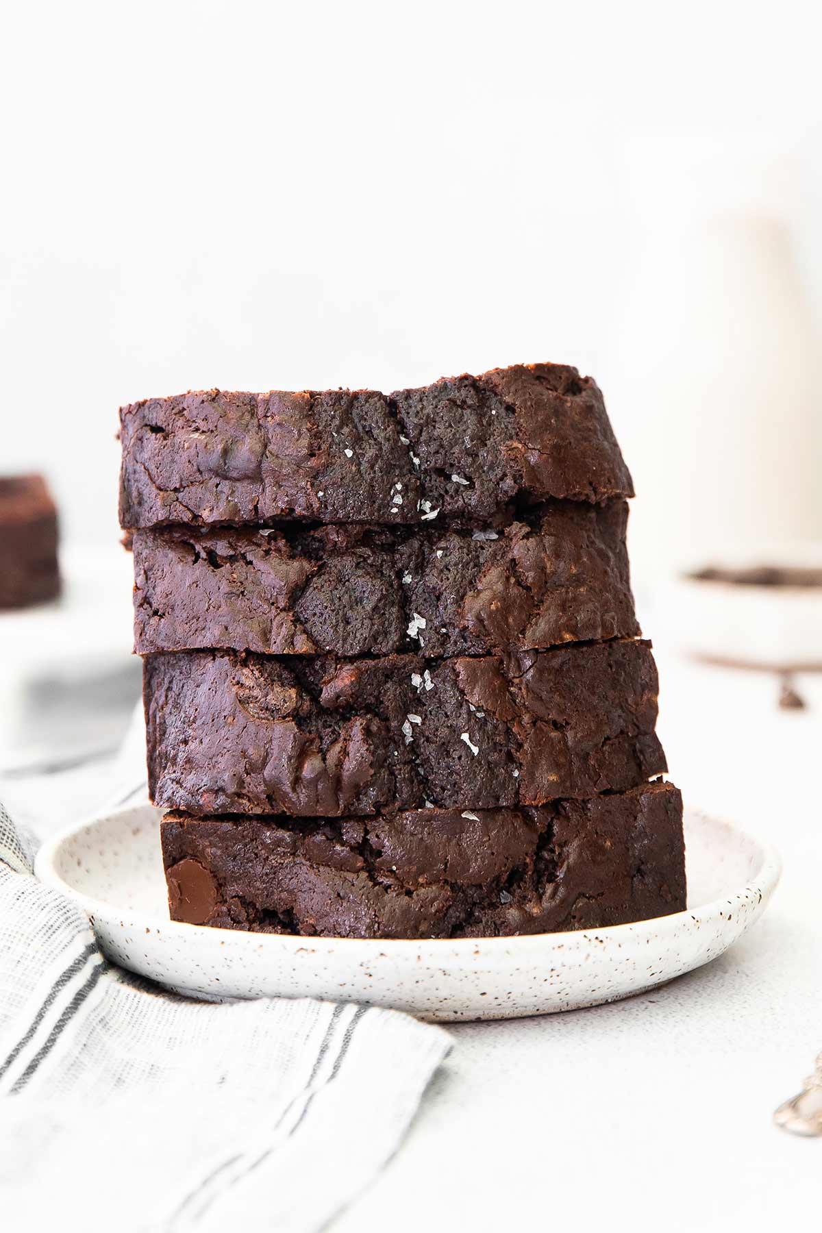 slices of chocolate zucchini bread on a plate.