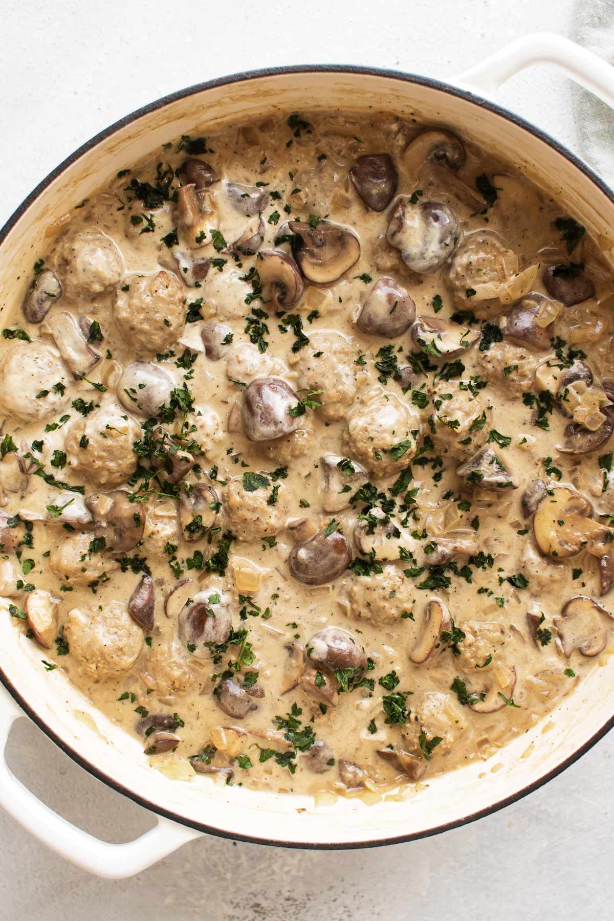 overhead shot of meatball stroganoff in a pan.