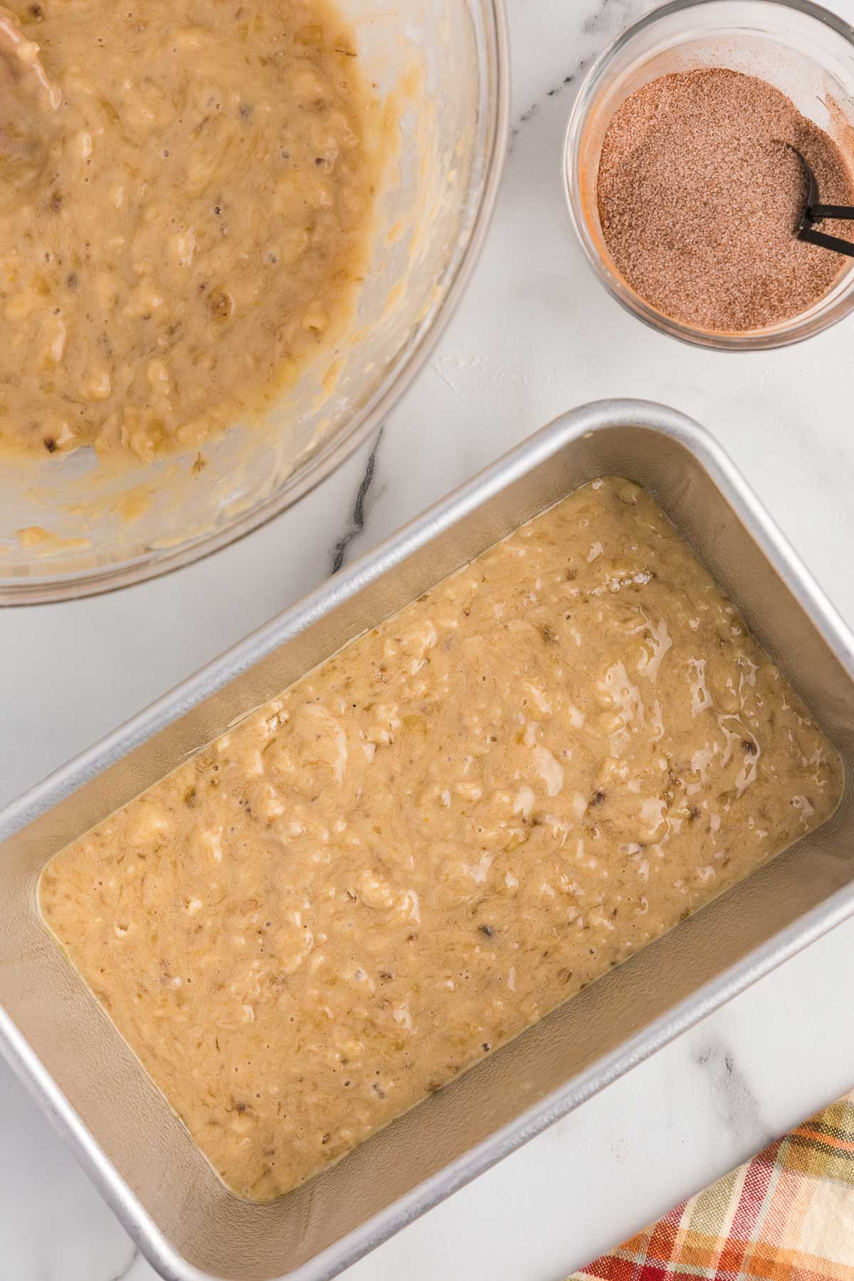 the first layer of batter in a pan.