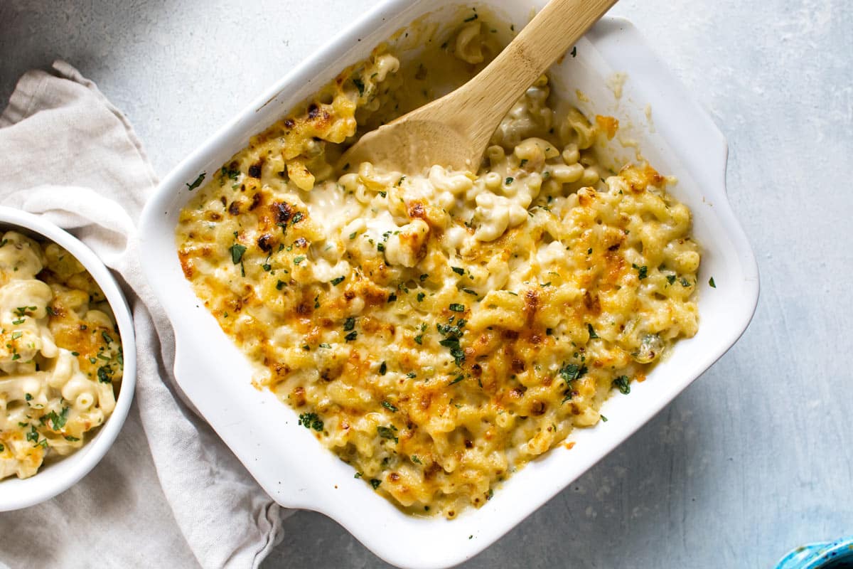a baking dish of mac and cheese with green chile.