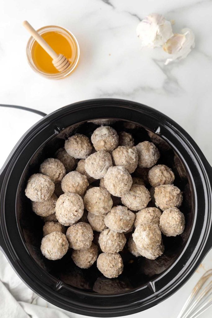 meatballs added to the slow cooker.