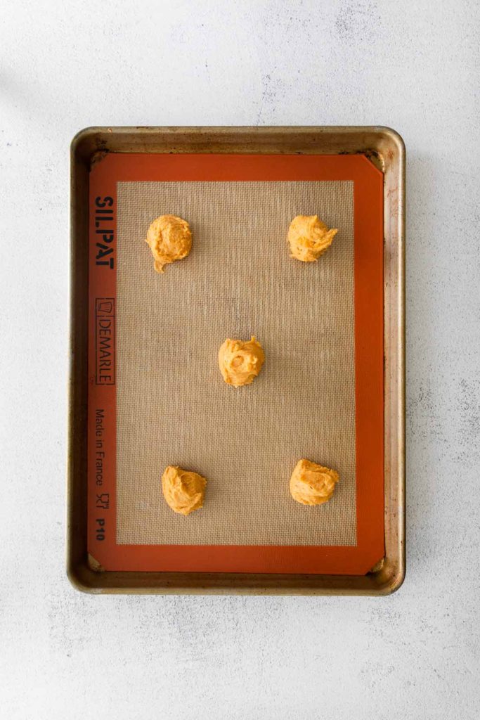 the cookie dough balls on a baking sheet.
