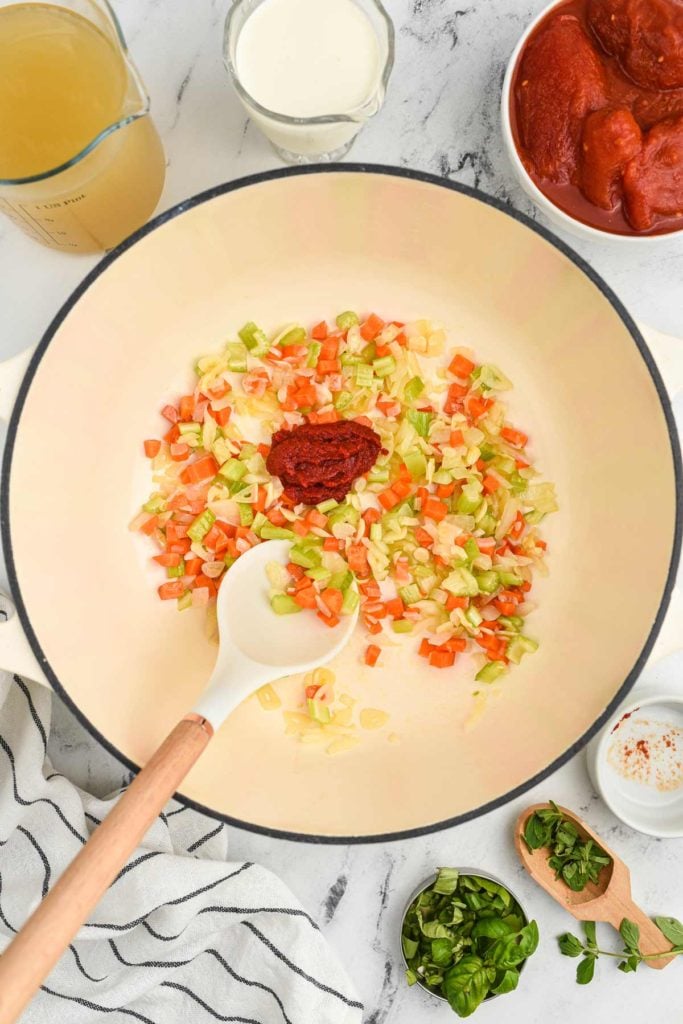 the vegetables being sauteed in a pan.