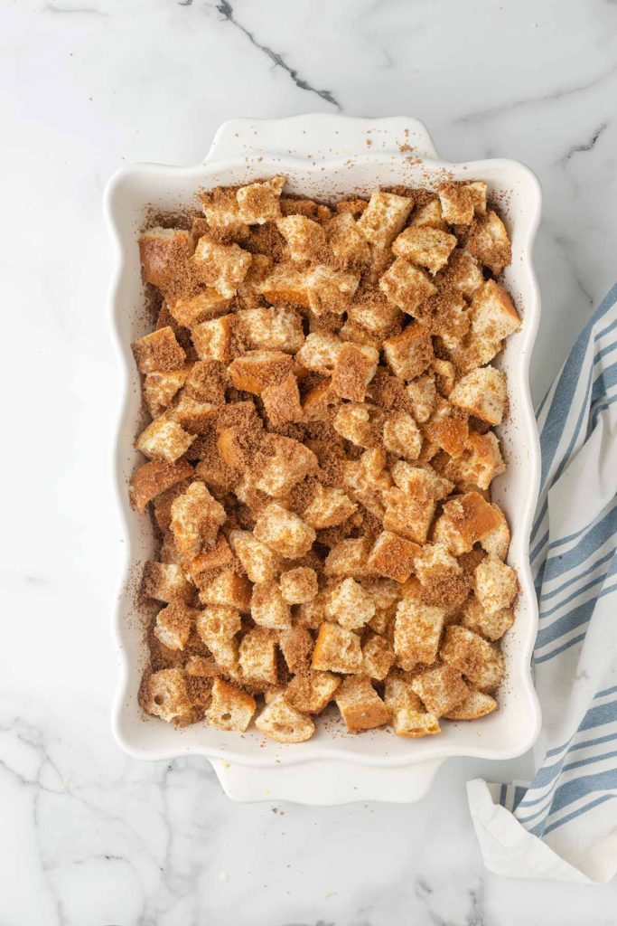 the soaked bread cubes in a baking dish.