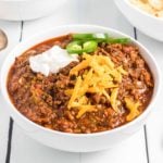 a bowl of no bean chili with toppings.