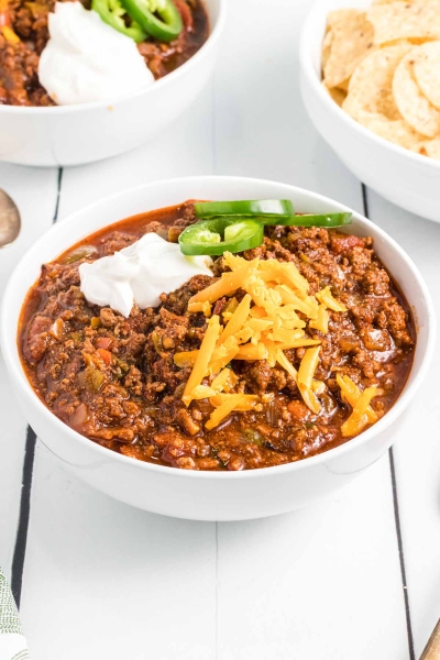 a bowl of no bean chili with toppings.