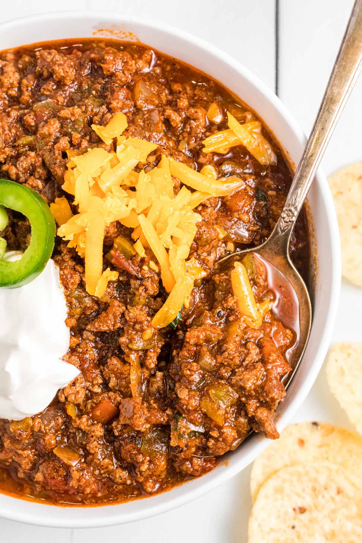 a bowl of chili with a spoon.