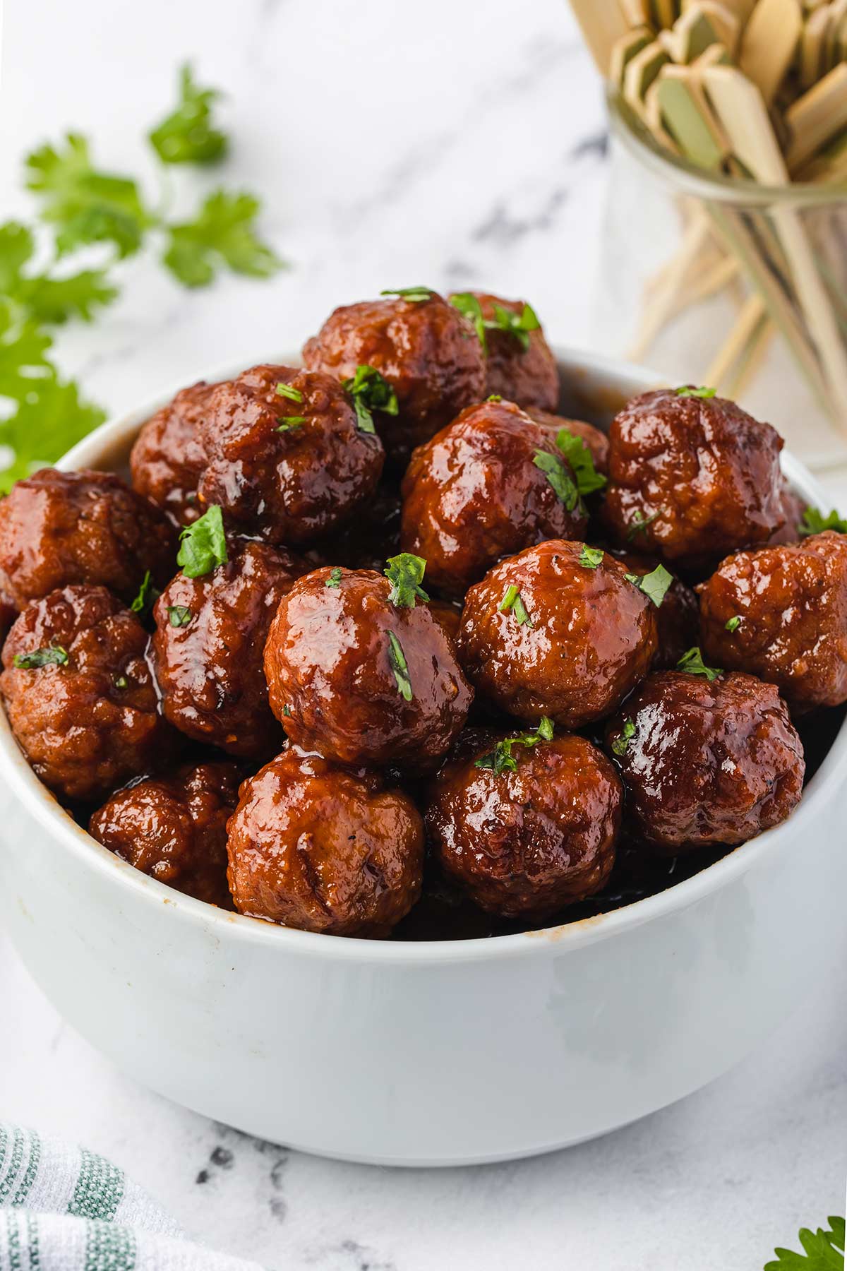 close-up shot of the meatballs in a white bowl.