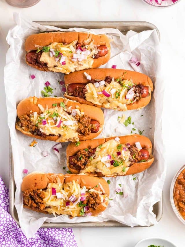 overhead shot of chili cheese dogs.