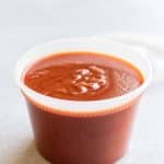 a container of enchilada sauce.