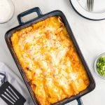 overhead shot of baked enchiladas in a pan.