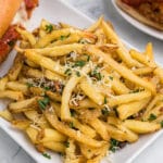 a plate of fries on a white plate.