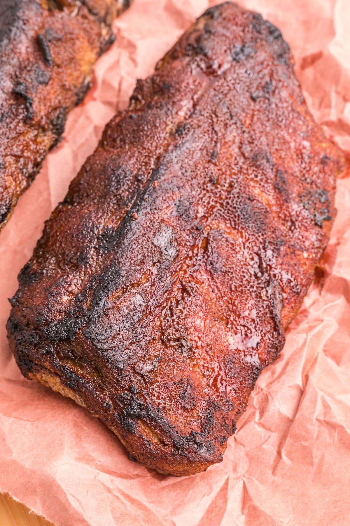 cooked rack of ribs on paper.